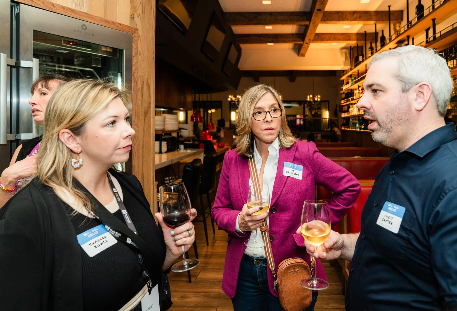 Group of attendees networking with drinks