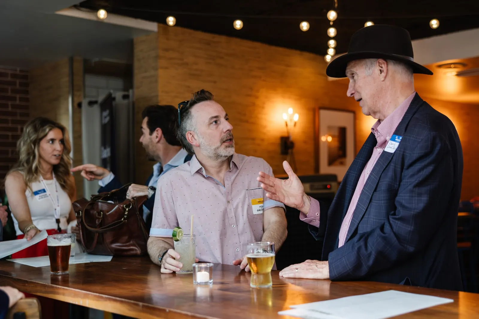 Campers chatting at a lively bar